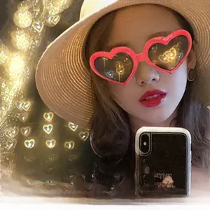 Close-up of stylish red heart-shaped frames with romantic light effects for parties