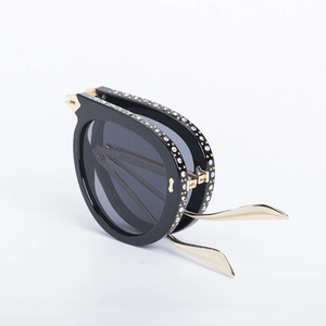 Foldable steampunk square sunglasses featuring black frames and gold metal temples with rhinestones