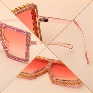 Oversized square pink sunglasses with rhinestone frames and gradient lenses shown in detail
