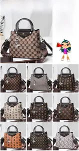 Detailed grid showing printed handbags with wide logo straps and various patterns