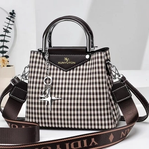 Houndstooth pattern shoulder bag with leather trim and silver metal handle for women