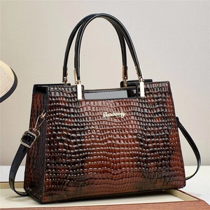 Lizard embossed tote bag in gradient tan leather with gold lock and black handles