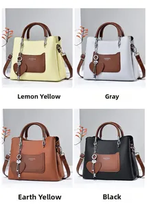 Detail of four-color pebbled leather handbags with heart pendant and fashion charm