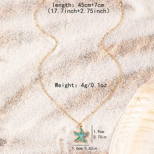 Golden necklace with blue starfish pendant and size details on a beach background