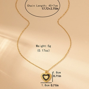 Gold chain necklace with black heart pendant featuring golden sunburst and size specs