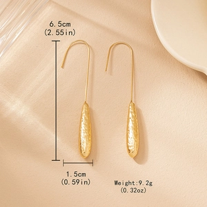 Elegant gold teardrop earrings with hammered texture finish for a vintage fashion look