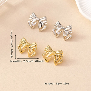 Elegant 2cm bow knot stud earrings set in gold and silver with textured metal finish