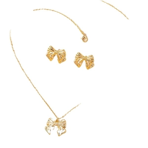 Golden bow jewelry set including bow pendant necklace and matching stud earrings