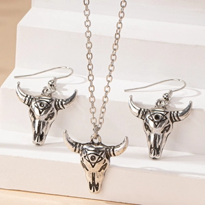 Retro bull skull jewelry set with engraved necklace and earrings in vintage boho style