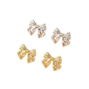 Elegant metallic bow stud earrings in gold and silver finish with textured surface