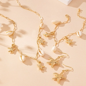 Goldschmuck-Set mit Seesternen und Muscheln inkl. Halskette Armband und Ohrringen für Urlaub