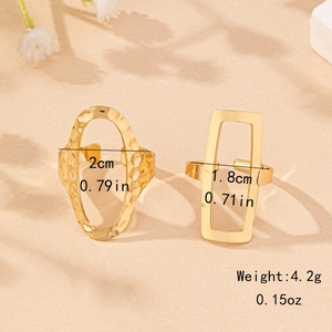 Set of two geometric hollow gold rings featuring oval hammered and rectangular polished designs