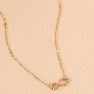 Elegant gold infinity symbol necklace with shimmering crystals for everyday fashion