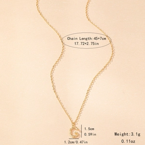 Macro detail of gold letter G necklace with bamboo texture showing dimensions 45+7cm
