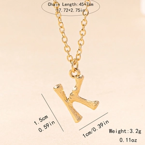Macro shot of gold bamboo texture letter K pendant with precise size specifications