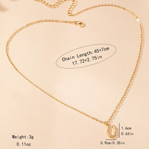 Detail view of golden bamboo style letter necklace with size measurements 45 plus 7cm