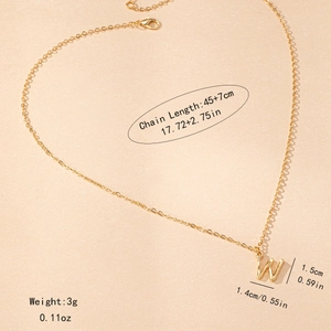 Detail view of golden W initial necklace with 45+7cm chain length and size specs