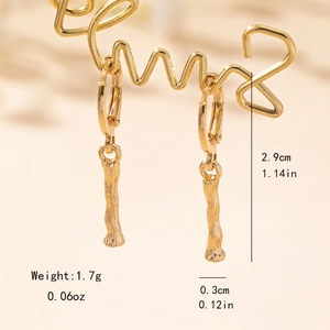 Macro shot of minimalist golden bamboo letter earrings showing 2.9cm branch texture