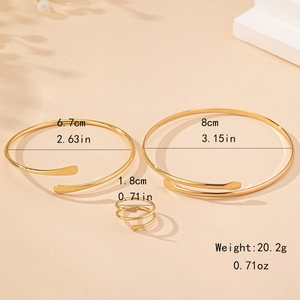 Elegant gold jewelry set with flattened open bangles and a spiral ring for women