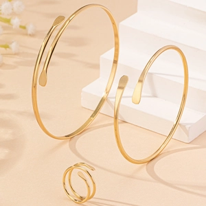 Three-piece gold plated jewelry set with flattened ends including bangles and ring