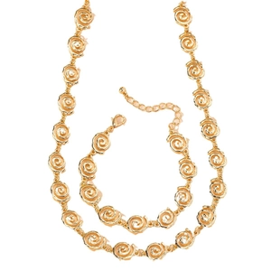 Elegant gold jewelry set with rose swirl design including matching necklace and bracelet