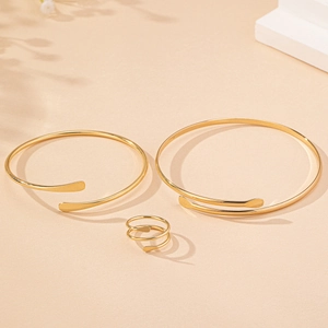Detailed view of minimalist gold plated jewelry set featuring flattened ends design