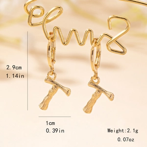 Detailed view of bamboo style letter T gold drop earrings with size measurements
