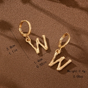 Close-up of gold bamboo-style letter W earrings with size and weight measurements