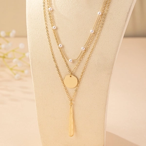 Elegant multi-layer gold-plated necklace with white pearls and teardrop pendants