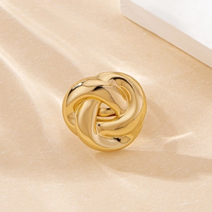 Polished gold twisted knot ring featuring a sleek circular design and elegant metallic shine