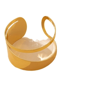 Elegant gold irregular cutout cuff bracelet with polished finish and geometric open design