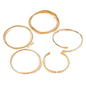 Elegant 5-piece gold bangle set featuring leaf textures and interlocking minimalist designs
