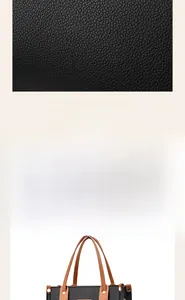Close-up of black litchi grain leather and brown handles on a large tote shoulder bag