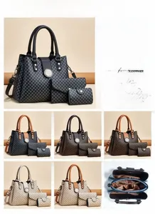 Detailed view of 3-piece printed tote bag set with internal compartments and textured PU