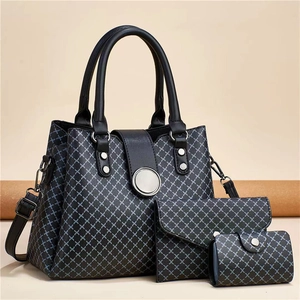 Detailed close-up of 3-piece bag set with grey geometric pattern and silver hardware