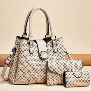 Detailed set of three beige geometric print bags including a large tote and pouches
