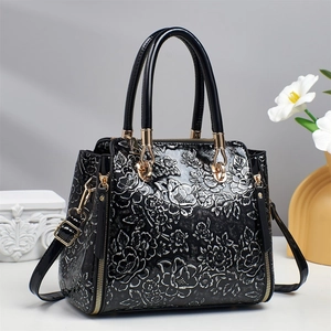 Three-piece tote bag set with silver floral embossing and classic black contrast trim