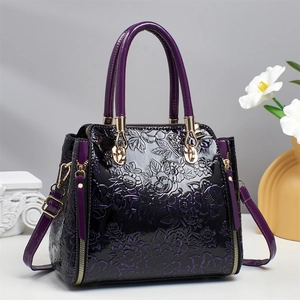 Purple gradient floral embossed handbag with gold hardware and removable shoulder strap