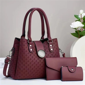 Three-piece burgundy tote set with woven texture, large handbag, wallet and card holder