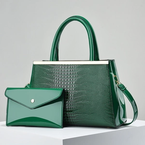 Dark green crocodile pattern tote bag set with matching envelope clutch and gold hardware