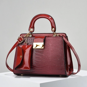 Deep red crocodile embossed handbag set with gold hardware and mini pouch charm