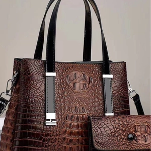 Brown crocodile embossed leather tote bag set with matching wallet and black handles