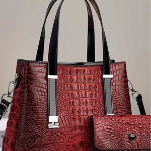 Deep red crocodile embossed large tote bag and matching pouch with high gloss finish