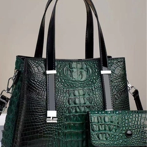 Dark green crocodile pattern leather tote bag and matching long wallet set with silver hardware