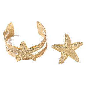 Golden starfish jewelry set featuring a textured open bangle and matching ring for women