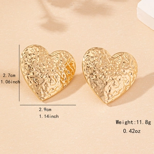Golden heart-shaped stud earrings with vintage hammered texture and metallic finish