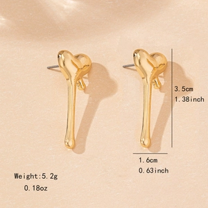 Elegant gold melting heart stud earrings with fluid design and polished metal texture