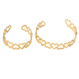 Elegant hollow heart gold-plated open bangles in two sizes on white background