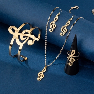 Polished gold music note jewelry set featuring treble clef necklace, bracelet and earrings
