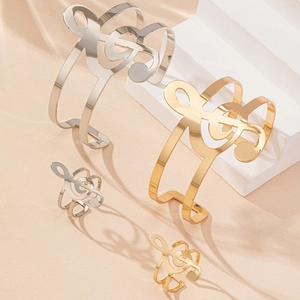 Elegant musical note jewelry set with gold and silver G-clef bracelets and rings